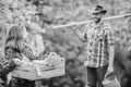 Flowers need my care. little girl and happy man dad. earth day. spring village country. family farm. ecology. Gardening Royalty Free Stock Photo