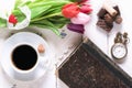 Flowers and old book with coffee and sweets Royalty Free Stock Photo