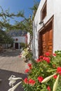 Flowers in Panagia Episkopi Church in Santorini island, Thira, Greece Royalty Free Stock Photo