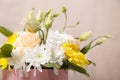 Flowers in a pink box close-up with a blurred background. Flowers as a gift, chrysanthemums, roses, as a background Royalty Free Stock Photo