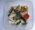 flowers in plastic box with semolina. Preparation for drying