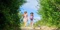 Flowers presentation. farming and agriculture. spring country side. children hold gardening tools. small girls farmer in