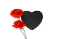 Flowers red poppies corn poppy, corn rose, field poppy with black paper card note in the shape heart with space for text