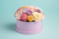 Flowers in round luxury present box on pastel background. Generative AI