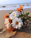 a bouquet of flowers sitting on a sandy beach Royalty Free Stock Photo