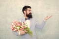 Flowers shop. Ideas to celebrate without breaking bank. Spring mood. Love date. Gift bouquet. Bearded man hipster with Royalty Free Stock Photo