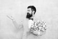 Flowers shop. Ideas to celebrate without breaking bank. Spring mood. Love date. Gift bouquet. Bearded man hipster with Royalty Free Stock Photo