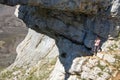 Flowers in spring, and natural stone arch in northern Spain