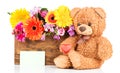 Flowers and a teddy bear