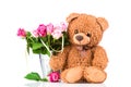 Flowers and a teddy bear