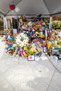 Flowers, teddy bears and messages of love spill over a squad car in Everett.