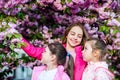 Flowers tender bloom. Kids enjoy cherry blossom. True friendship. Pink our favorite. Children spring garden. Sakura Royalty Free Stock Photo