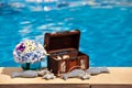 Flowers textile stuffed fish and treasure chest next to the pool Royalty Free Stock Photo