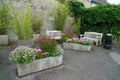 Flowers troughs and wooden benches