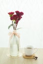 Flowers, vase and coffee by the window Royalty Free Stock Photo