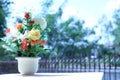 Flowers in a vase multiplicity paint outdoors in the garden