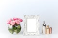 Flowers vase and vintage frame on white Royalty Free Stock Photo