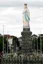 Flowers for Virgin Mary in pilgrim town Lourdes Royalty Free Stock Photo