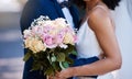 Flowers, wedding or marriage with a bride and groom outdoor together after a ceremony of tradition or celebration