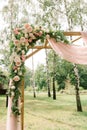 Flowers on a wooden arch