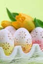 Flowery Easter eggs in an egg holder Royalty Free Stock Photo