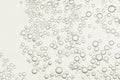 Flowing bubbles over a beige surface Royalty Free Stock Photo
