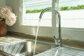 Flowing , clean, fresh tap water to the kitchen sink. Royalty Free Stock Photo