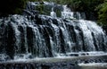 Flowing Purakaunui Falls in the Catlins in the South Island in New Zealand Royalty Free Stock Photo