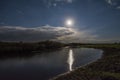 Biebrza river in the Biebrza national park in Poland by night with a full moon reflecting in the water Royalty Free Stock Photo