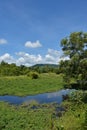 Flowing river and tourist vacation in Thailand in this peaceful setting.