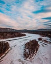 Flowing river at winter. Winter landscape with a River and Winter Forest. aerial view from icy river in winter Royalty Free Stock Photo