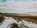 Flowing river at winter. Winter landscape with a River and Winter Forest. aerial view from icy river in winter Royalty Free Stock Photo