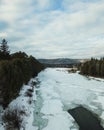 Flowing river at winter. Winter landscape with a River and Winter Forest. aerial view from icy river in winter Royalty Free Stock Photo