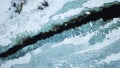 Flowing river at winter. Winter landscape with a River and Winter Forest. aerial view from icy river in winter Royalty Free Stock Photo