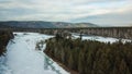 Flowing river at winter. Winter landscape with a River and Winter Forest. aerial view from icy river in winter Royalty Free Stock Photo