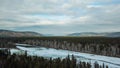 Flowing river at winter. Winter landscape with a River and Winter Forest. aerial view from icy river in winter Royalty Free Stock Photo