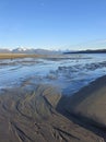 Flowing sand patterns on a beach in Southeast Alaska on a sunny winter day at low tide Royalty Free Stock Photo