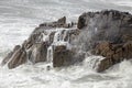 Flowing sea water in a cliff Royalty Free Stock Photo