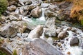 Flowing stream through green mossy rocks in forest, Royalty Free Stock Photo