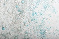 Flowing water, blue and grey bubbles Royalty Free Stock Photo