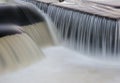 Flowing water cascading over a weir on yorkshire river Royalty Free Stock Photo