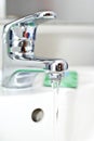 Flowing water faucet Royalty Free Stock Photo