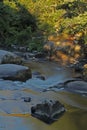 Flowing water over rocks and boulders Royalty Free Stock Photo