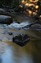 Flowing water over rocks and boulders Royalty Free Stock Photo