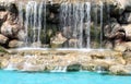 Flowing waterfall swimming pool Royalty Free Stock Photo