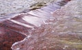 Flowing water in the fountain. decorative, natural. Royalty Free Stock Photo