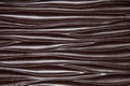 Flowing waves of Chocolate Brown wood texture background