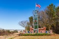 City of Flowood welcome sign with American Flag waving in the wind, and some holiday Royalty Free Stock Photo