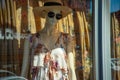 flowy summer dress on mannequin with hat and sunglasses