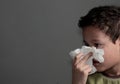 The flu child blowing nose after catching a cold with background stock photo Royalty Free Stock Photo